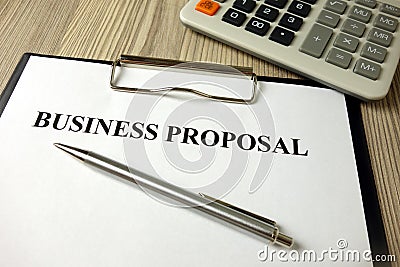 Business proposal document with pen and calculator Stock Photo