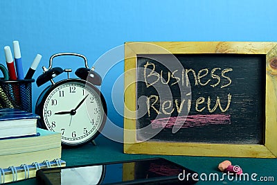 Business Review Planning on Background of Working Table with Office Supplies. Stock Photo