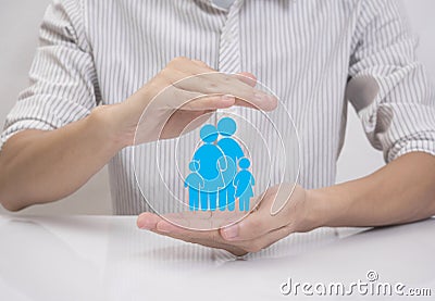 Business salesman agent hand holding family icon Stock Photo