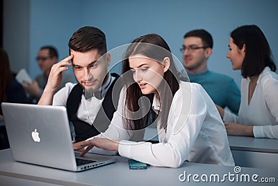 2016.01.17 Business school training in the Samara State University. Handsome couple of students use Laptop while Editorial Stock Photo