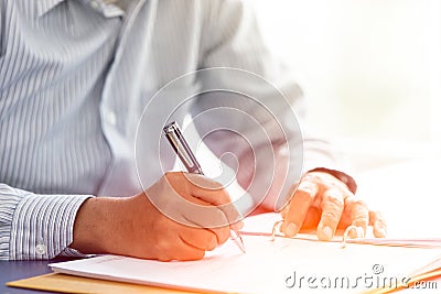 Business senior boss sign contract closeup hand write on paper report Stock Photo