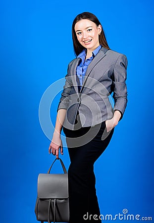 Business. Shool girl with knapsack. stylish woman in jacket with leather backpack. girl student in formal clothes Stock Photo