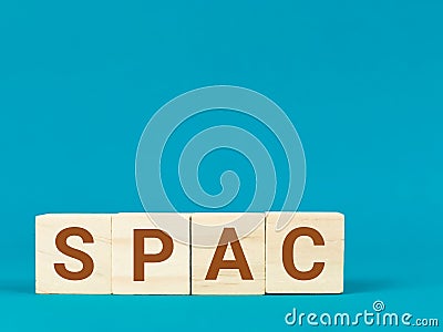 Business and SPAC, special purpose acquisition company concept on wooden cubes. Stock Photo