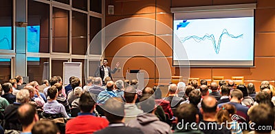 Business speaker giving a talk in conference hall. Editorial Stock Photo