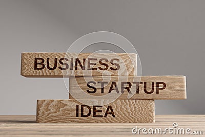 Business startup idea wooden blocks balance concept Stock Photo