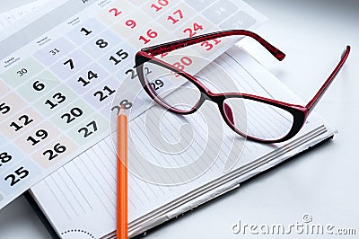 Business still-life, recording ideas, glasses, calendar and notes Stock Photo