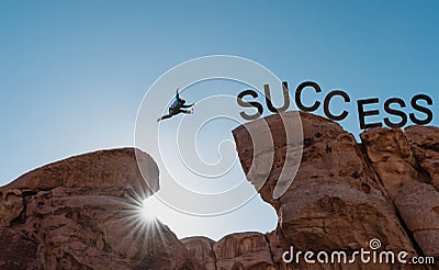 Business success, challenge, achievement and leadership concept. Silhouette a man jumping over precipice to success Stock Photo