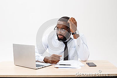 Business and success. Handsome successful African American man wearing formal suit, using laptop computer for distant Stock Photo