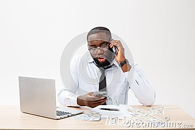 Business and success. Handsome successful African American man wearing formal suit, using laptop computer for distant Stock Photo