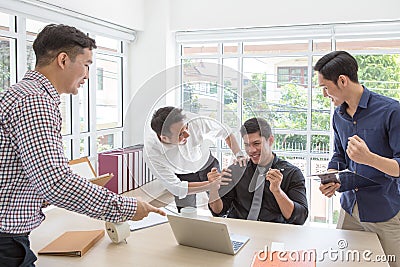 Business successCelebrate success. Business team celebrate a good job in the office. Stock Photo