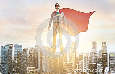 Business super hero hover over city skyline Stock Photo