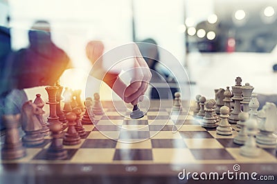 Business tactic with chess game and businessmen that work together in office. Concept of teamwork, partnership and Stock Photo