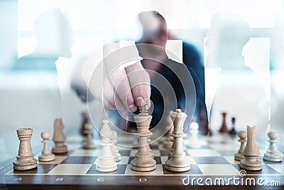 Business tactic with chess game and businessmen that work together in office. Concept of teamwork, partnership and Stock Photo