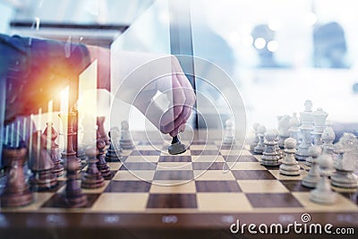 Business tactic with chess game and businessmen that work together in office. Concept of teamwork, partnership and Stock Photo