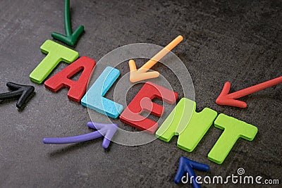 Business talents finding, recruitment for HR, Human Resource concept, colorful arrows pointing to alphabet TALENT at the center of Stock Photo