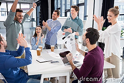 Business team celebrating success together on workplace in office Stock Photo