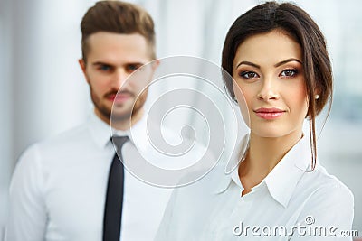 Business Team. Happy smiling people standing in a row at office Stock Photo