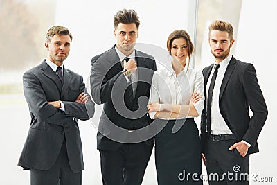 Business Team. Happy smiling people standing in a row at office Stock Photo