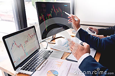 Business Team Investment Entrepreneur Trading discussing and analysis data the stock market charts and graphs negotiation and rese Stock Photo