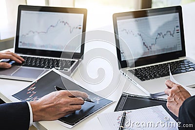 Business team investment working with computer and analysis graph stock market trading with stock chart data, business and techno Stock Photo