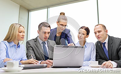 Business team with laptop having discussion Stock Photo