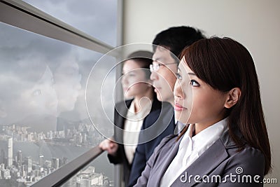 Business team look city through window Stock Photo
