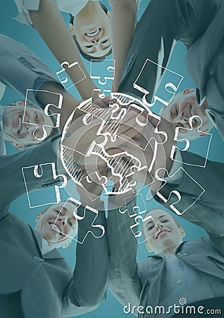 Business team looking down putting hands together behind white jigsaw doodle and against blue backgr Stock Photo