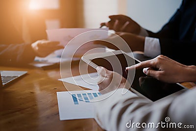 Business team meeting and discussing with financial analyst business development strategy project and using modern digital tablet Stock Photo