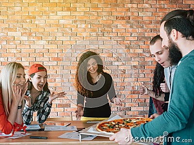 Business team millennials lunch break pizza meal Stock Photo