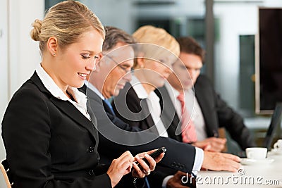 Business - team in office checking mails Stock Photo