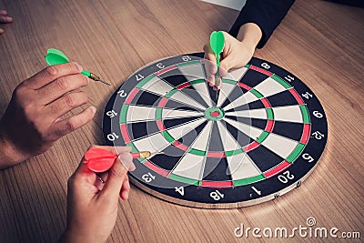 Business team pointing to a darts aiming at the target center business,Targeting the business concept Stock Photo