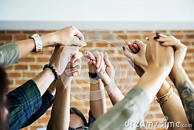 Business team raising their hands up to celebrate Stock Photo