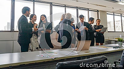 Business team relaxing meeting . Diverse business people standing together at startup. Concept executive meeting at the indoor Stock Photo