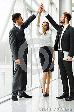 Business Team. Successful Business People Celebrating a Deal Stock Photo