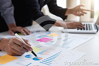 Business team two colleagues discussing working with many document graph in team Meeting Talking Brainstorming Communication Stock Photo