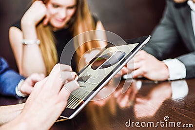 Business team using tablet computer to work with financial data Stock Photo