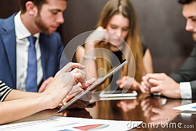 Business team using tablet computer to work with financial data Stock Photo