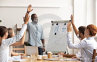 Business team voting concept, african coach and employees raise hands Stock Photo