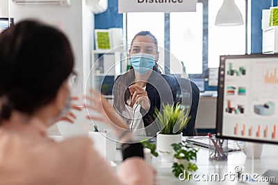 Business team wearing medical face mask to prevent infection with coronavirus Stock Photo