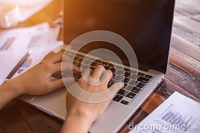 Business team working on laptop, while sitting at office. Business people Stock Photo