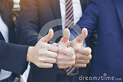 Business teamwork partners giving Thumb up Successful Stock Photo