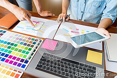 Business technology concept, creative team designer choosing samples with UI/UX developing on sketch layout design mockup on Stock Photo