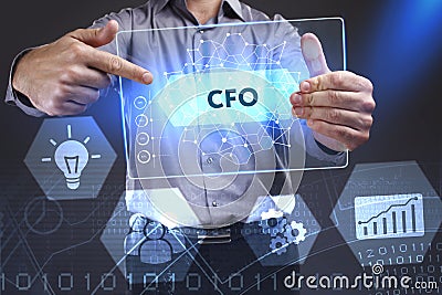 Business, Technology, Internet and network concept. Young businessman showing a word in a virtual tablet of the future: CFO Stock Photo