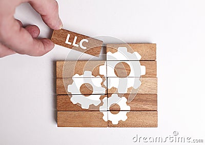 Business, Technology, Internet and network concept. Young businessman shows the word: LLC Stock Photo