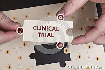 Business, Technology, Internet and network concept. Young businessman shows the word: Clinical trial Stock Photo