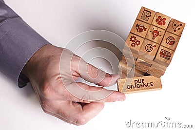 Business, Technology, Internet and network concept. Young businessman shows the word: Due diligence Stock Photo