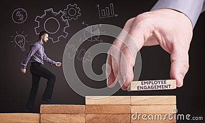 Business, Technology, Internet and network concept. Young businessman shows the word: Employee engagement Stock Photo