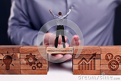 Business, Technology, Internet and network concept. Young businessman shows the word:Recommendation Stock Photo