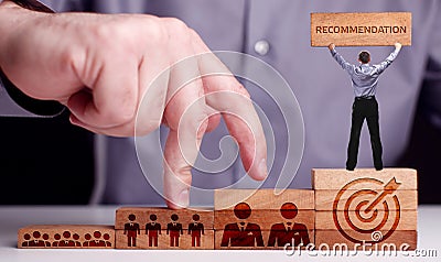 Business, Technology, Internet and network concept. Young businessman shows the word:Recommendation Stock Photo