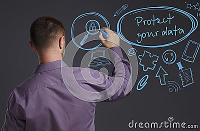 Business, Technology, Internet and network concept. A young businessman writes on the blackboard the word: Protect your data Stock Photo